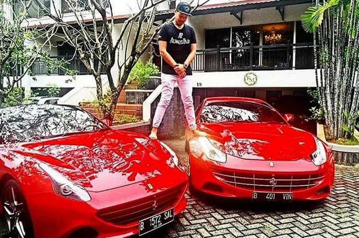 Mr Richard Muljadi, a grandson of Indonesian entrepreneur Kartini Muljadi, astride his two red Ferraris.PHOTO: INSTAGRAM/RICHARD MULJADI