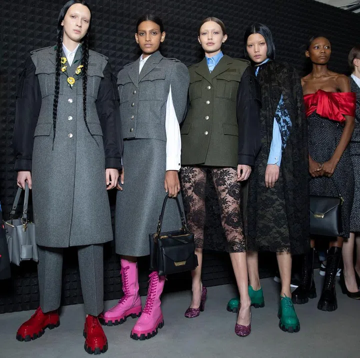 With a menswear show in January that took love as its theme but Frankenstein’s monster as its main trope, Miuccia Prada showed the world that she’s the master of duality and juxtaposition, all delivered with a left-field visual punch. She pushed that same train of thought even deeper for her womenswear show, this time with the bride of Frankenstein putting in a cameo. One might expect a collection titled “The Anatomy of Romance” to be filled with sweetness and light, but subversion has always been a Prada speciality. The overall vibe was militaristic, with heavy-duty combat boots worn with everything from olive fatigues to sheer lace dresses. Certain silhouettes evoked Mid-century couture but came sculpted in padded nylon and sturdy, sombre wool. The most overt nods to romance were flowers but here, even they were
drooping and decayed—wilting off skirts, dresses and bags.