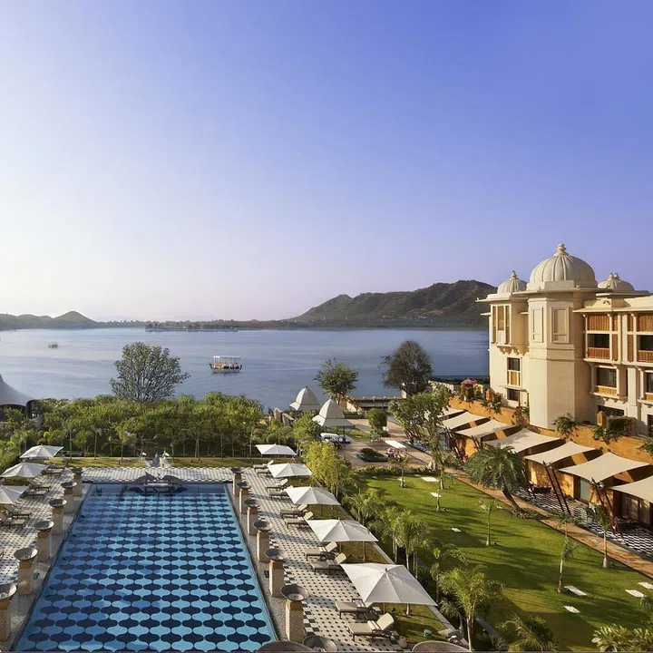 Gaze out over soul-stirring Lake Pichola in Udaipur from the prime vantage point of own your balcony. The lake, built in 1362, and misty Aravalli Mountains lie in the distance.