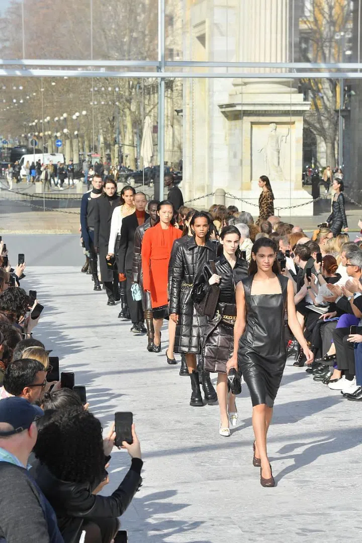 It was the most anticipated debut of the season and Daniel Lee did not disappoint. Those who expected Phoebe Philo’s former protégé to take on the mantle of old Céline were in for a pleasant surprise.
Yes, there was the awkwardly proportioned (and therefore appealingly chic) footwear as well as geometric, clean-lined bags but overall, Lee brought a darker, more dynamic edge to a House that leaned towards retro under his predecessor. Still, Lee’s not a radical. His updated vision of Milanese chic was a departure from Tomas Maier’s brand of glamour but it was still respectful of the House’s heritage. The intrecciato weave of the brand’s iconic bags was blown up and transposed onto ready-to-wear. Glamour was still there in the form of leopard spots and sequins, but cut into
easy daywear shapes like shirtdresses. Most compelling were the knits— artfully deconstructed, twisted and draped into alluring new forms.