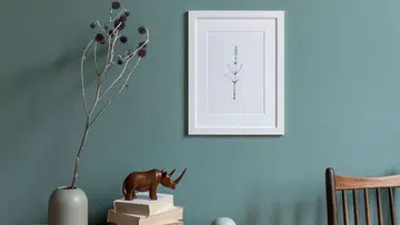 Minimalistic composition of sitting room interior with white mock up picture frame. Design home decor. Template. Eucalyptus color concept.