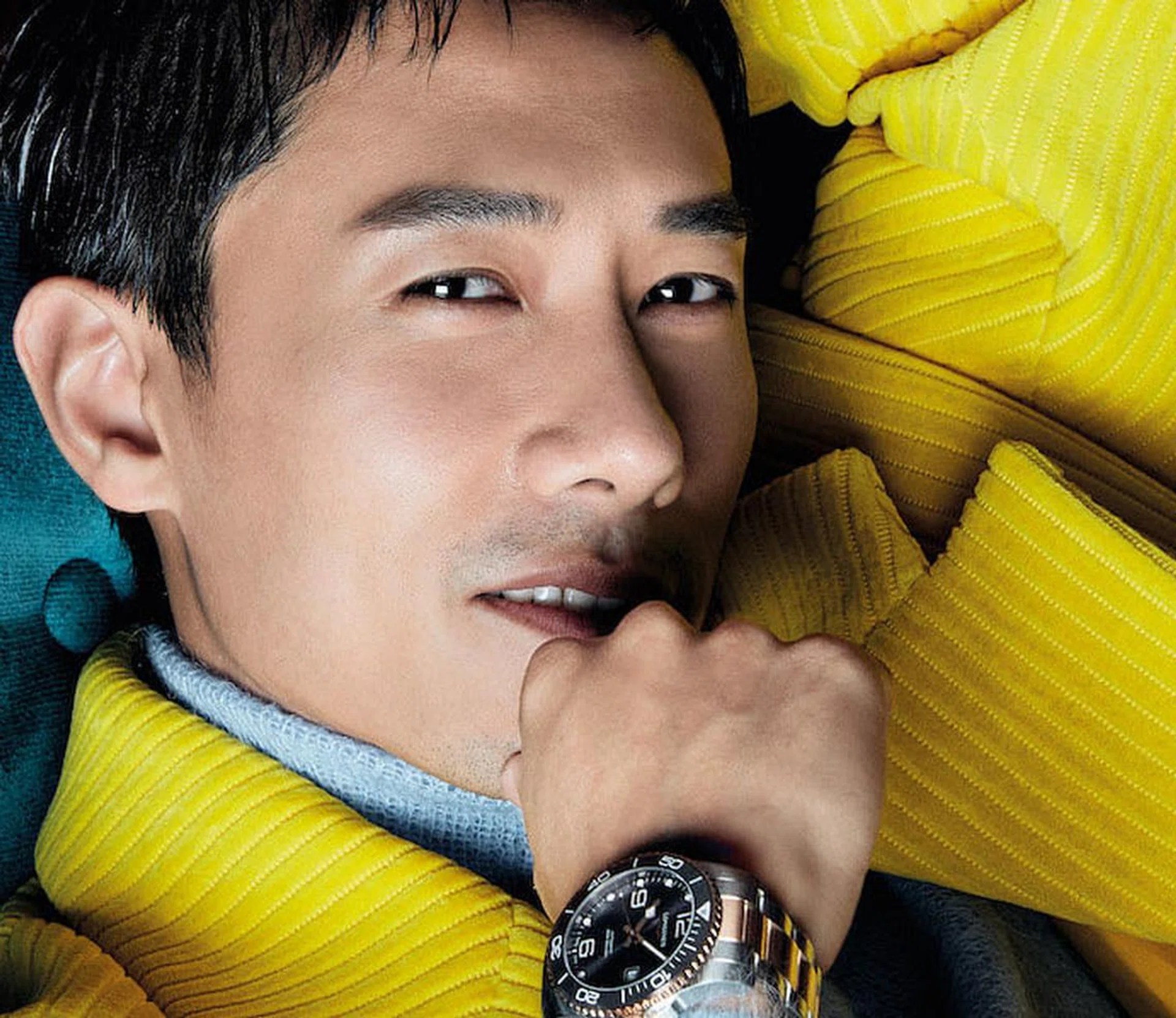Desmond Tan wears coat and sweater, both from Prada; steel and rose gold PVD HydroConquest watch, from Longines. (Photo: Gan)
