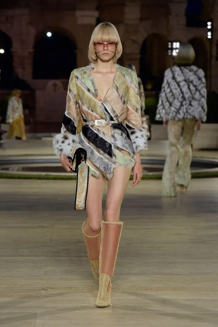 Silvia Venturini Fendi is another designer tasked with moving a legacy house forward in the wake of Karl Lagerfeld’s passing and she has done it with respect— not by mining his vast archives, but by channelling the duality of his creative spirit. Lagerfeld was always enchanted by the past, yet he constantly sought out the new and the extraordinary. For this couture spectacular staged al fresco in an ancient Roman temple, the artistry she teased out of the Fendi fur ateliers were extraordinary indeed. They took as inspiration the ancient mosaics and marbles from the fl oors of grand Roman villas, and translated them into graphic Art Deco motifs. What looked like prints were actually highly elaborate intarsia; fur strips were woven every which way, sheared to look like feathers, threaded between gauze, or bonded with the lightest tulle. The clothes these techniques were employed on had a ’70s fl avour, with fl ared trousers, bishop sleeves and high cinched waists aplenty. There was also a dazzling array of fl oor-sweeping reversible coats—under which Venturini Fendi layered bra tops, short shorts and transparent pieces to keep things light and modern. Lagerfeld would have been proud. 

Photo: Courtesy
