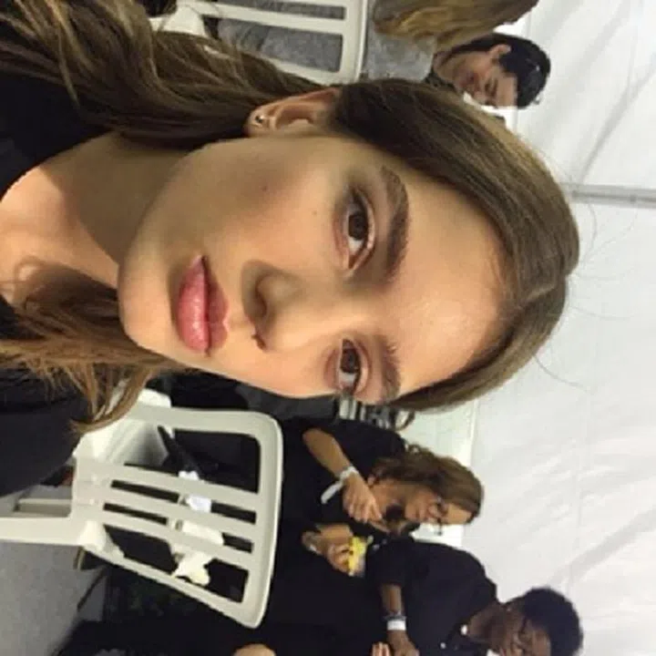 Beauty made effortless with filled-in brows and rosebud lips.