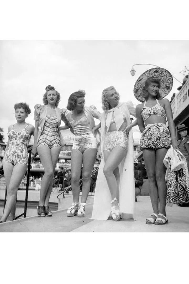 Take your bathing suit the retro route with high-waisted short bottoms (and a matching oversized hat never hurts either).
