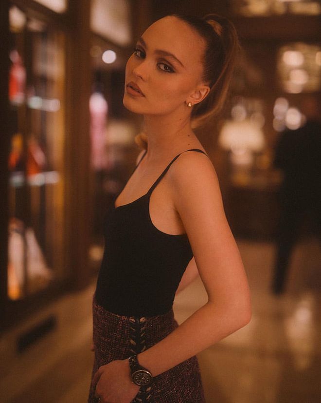 Lily-Rose Depp, wearing the J12 watch in Black Ceramic. Photo: Courtesy
