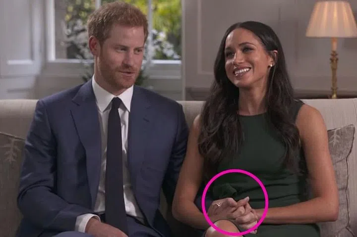Prince Harry and Meghan Markle holding hands. Photo: Getty 