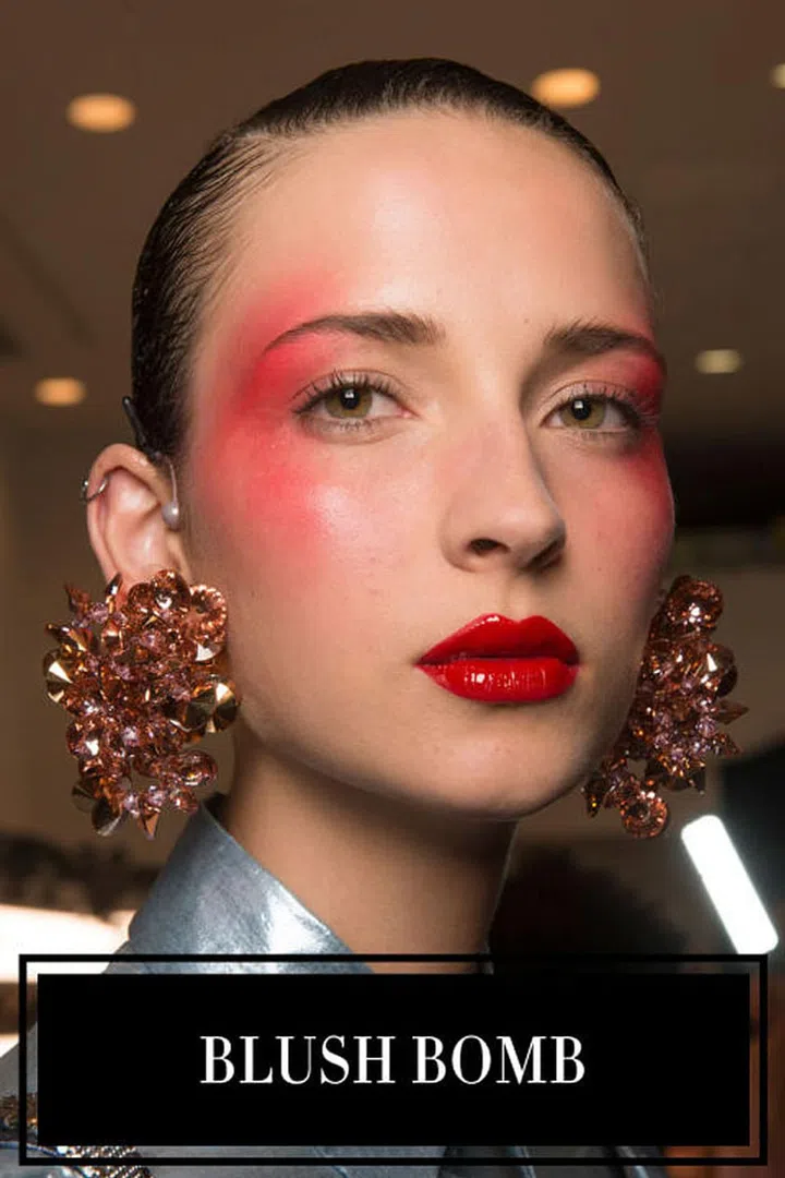 Get your blush brushes ready—you're going to need them in a big way next spring. Whether applied with a heavy-hand and a nod to disco (like at Kenzo, left) or subtly blended from cheek to temple (Reem Acra, Chanel, Adam Selman) blush was meant to be seen on the spring runways. Leave subtlety at the door.