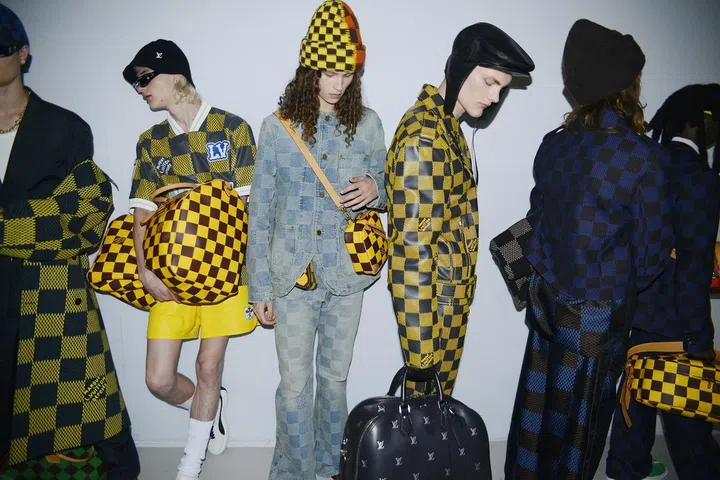 Backstage at the show, where models sported Williams’ new takes on the House codes, which include reinterpretations of the Damier check and luxe leather versions of the Speedy bag.