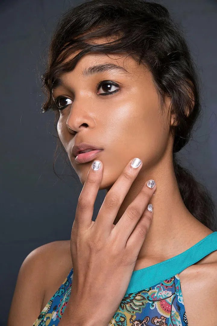 INSPIRED BY: Philip Lim Spring/Summer '17.
WHY WE LOVE IT: When worn over a neutral lacquer, a rose-gold French, simple silver line, or textured 14-karat tip is a refined way to pull off a precious metal manicure. For the best transition from a winter white look, add a metallic overlay by brushing a platinum polish on top as seen at 3.1 Philip Lim. The result: easy, elegant, and elevated.