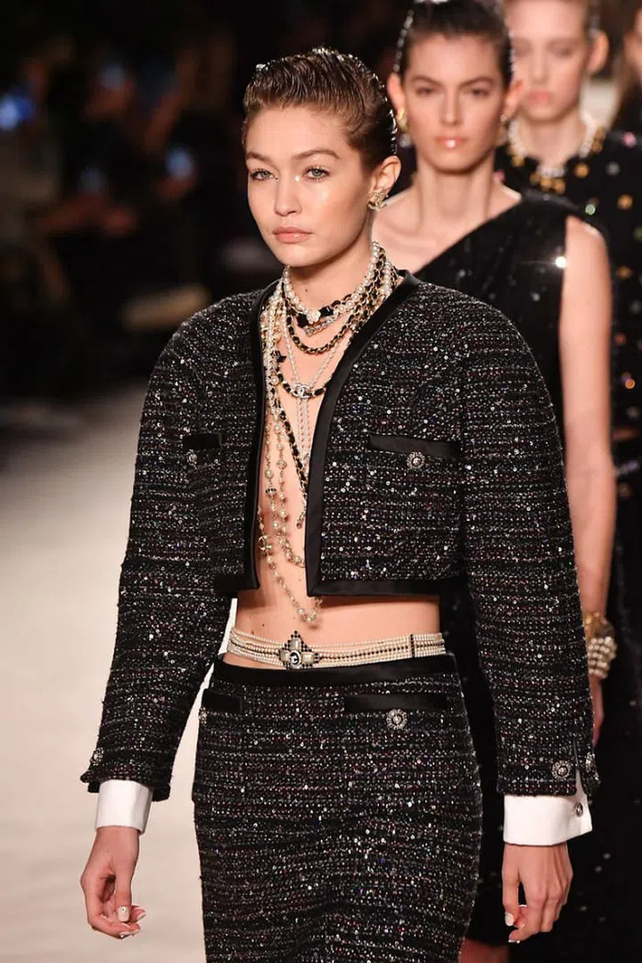 Gigi Hadid dons a pearl hip belt in the Chanel Metiers d’Art show.

Photo: Getty