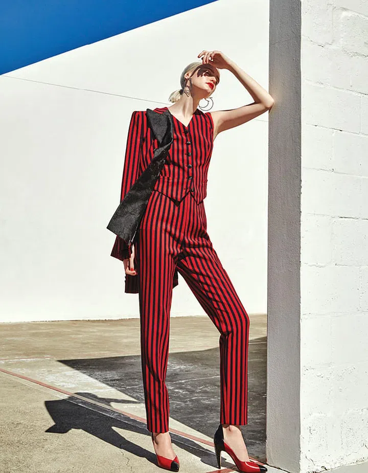 Silk and wool jacket; silk and wool vest; silk and wool pants, Dolce&Gabbana. Metal earrings, Salvatore Ferragamo. Leather and snakeskin pumps, Givenchy