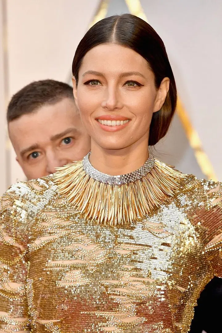 Totally normal way to pose with one's wife! Photo: Getty 