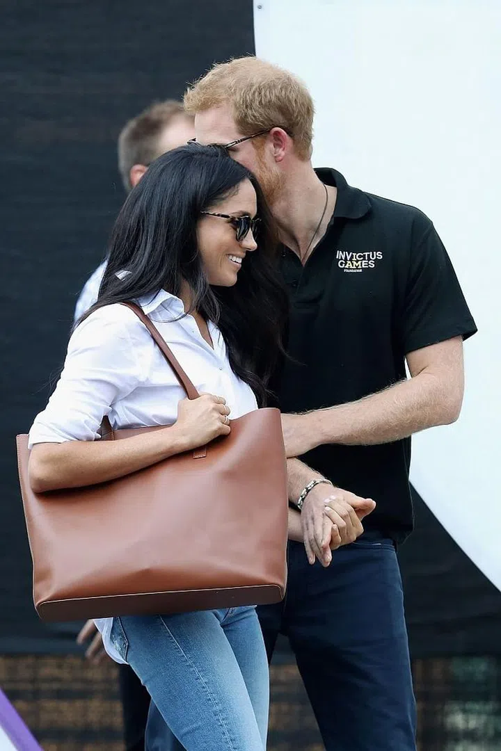 It's 2018 and Prince Harry shows no signs of stopping his protocol-breaking behavior. Despite the royal family's unspoken rule about not showing PDA during public events (notice how William and Kate never hold hands?), Harry held onto Meghan's hand during their first official appearance together.