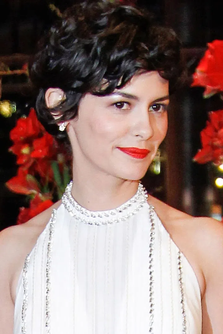 Audrey Tatou embraces her thick curls with a pixie cut and plenty of volume.