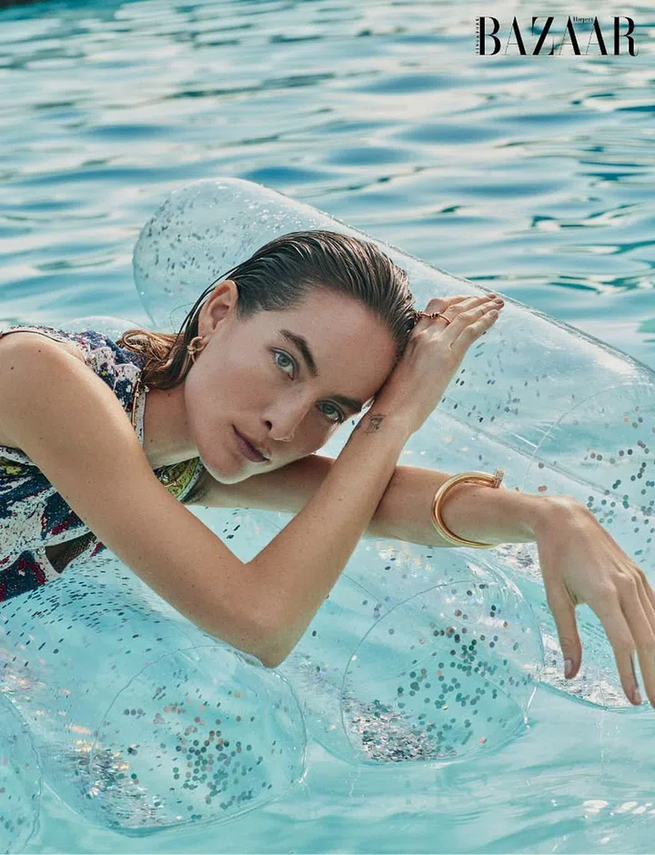 Dress; boot, Bottega Veneta. Rose gold and diamond Juste un Clou earring; rose gold Écrou de Cartier necklace; gold and diamond Juste un Clou (large) bangle; gold, tsavorite garnet and onyx Panthère de Cartier cuff, Cartier. Earrings (top; worn throughout),
model’s own