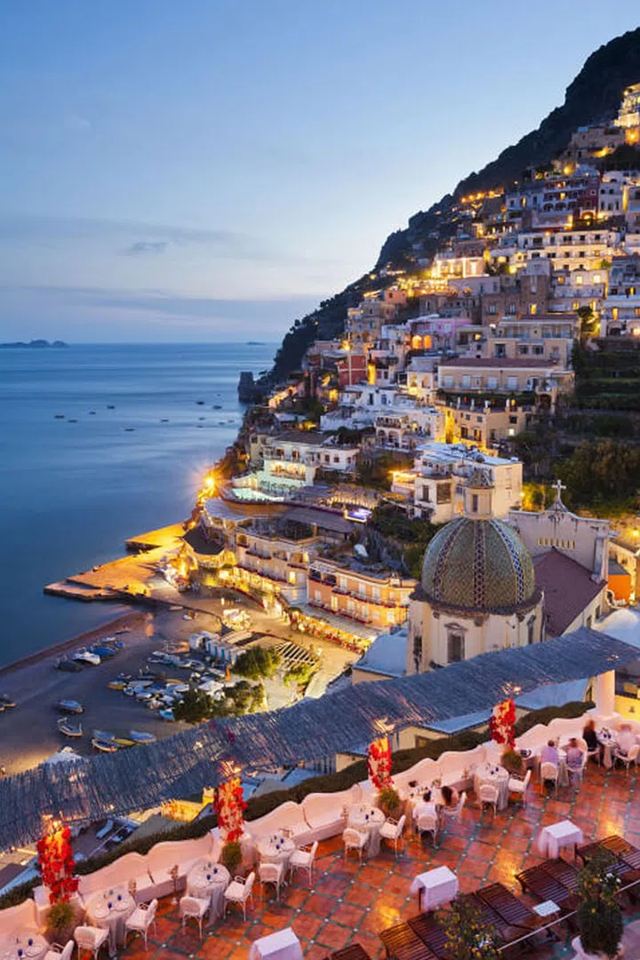The town of Positano on Italy's Amalfi Coast has been a go-to honeymoon destination for years and it's no surprise. Amazing views, fantastic wine and delicious Italian food typically make for happy newlyweds. Photo: Getty