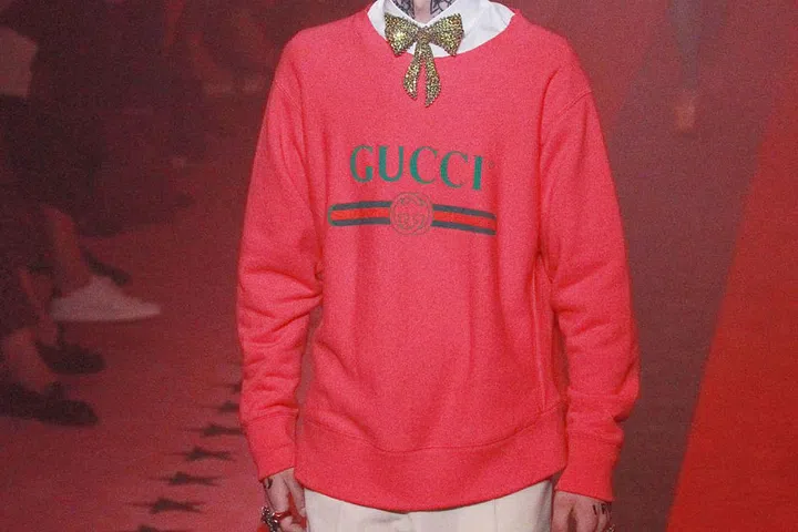 GUCCI LOGO JUMPER
Logos are back in a big way at the moment, as demonstrated on the catwalks at Gucci and Dolce & Gabbana. it's Gucci's oversized pink sweater that we can most imagine pairing with a midi-length skirt and trainers.