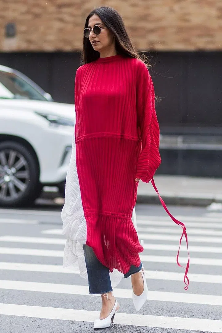 Wearing a fitted dress is never going to look good over jeans – it will more likely than not look bulky. So instead, choose oversized smock shapes or go a size higher than you usually would. Photo: Getty 