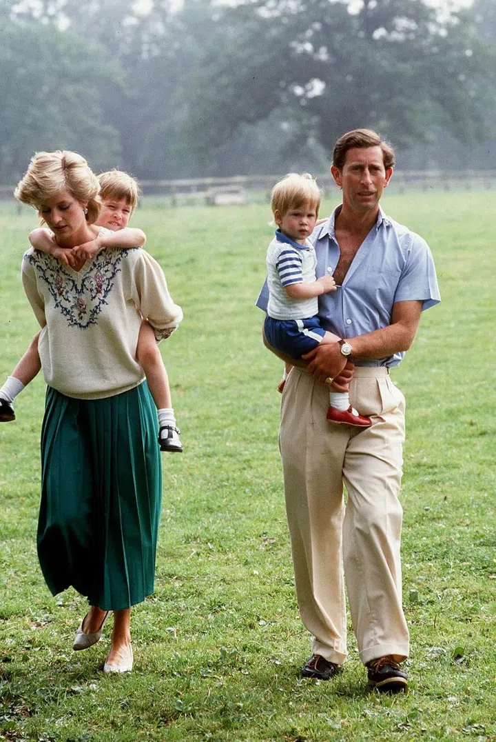 Prince William And Prince Harry with their parents in the gardens of Highgrove House.