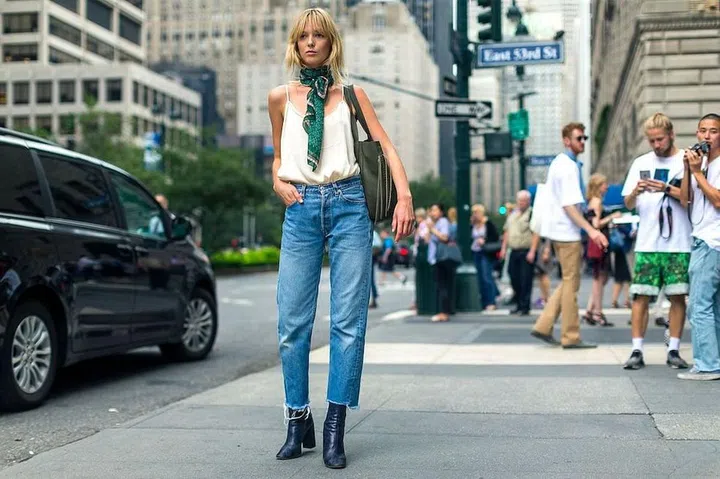 Make jeans and a tank feel new with the help of a colorful printed scarf worn around your neck.

Photo: Diego Zuko