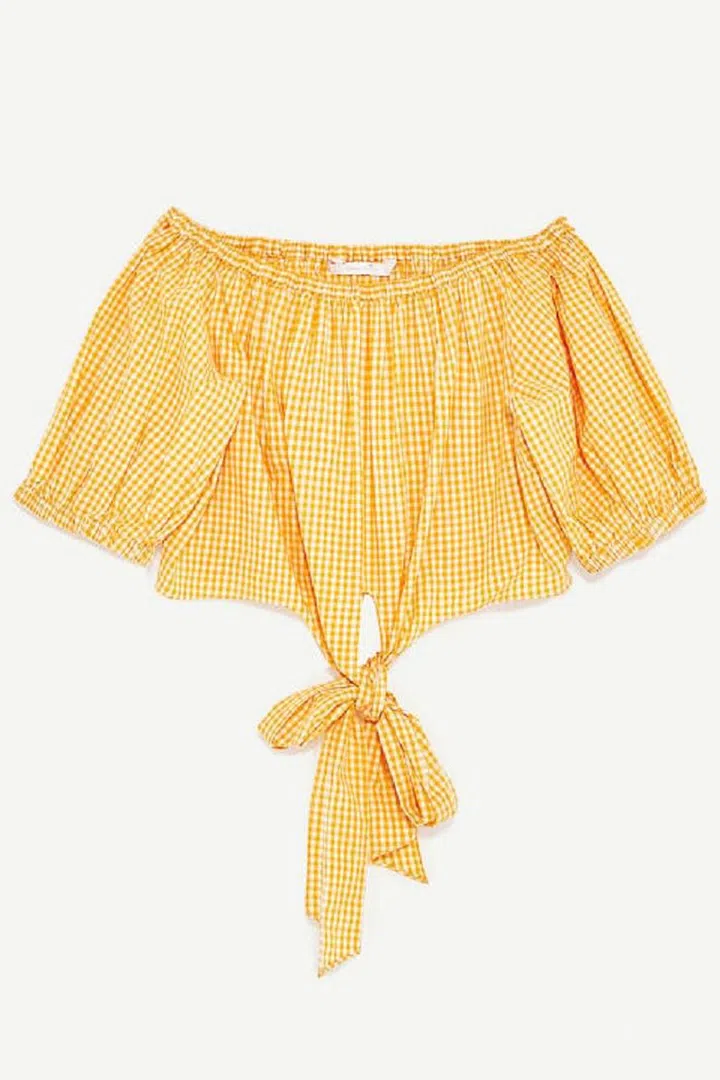 Team with a floaty summer skirt in the sun or layer over a black polo-neck and cropped flares for an offbeat evening look. Cotton top, £19.99, Zara