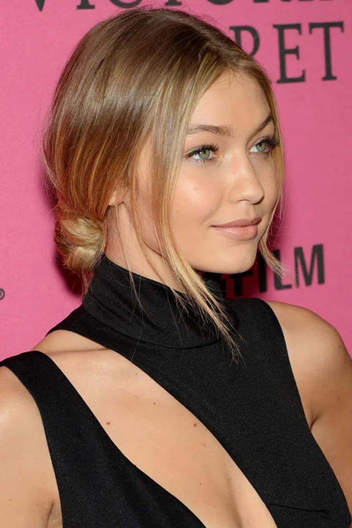 After the Victoria's Secret runway show, Hadid twists her hair into a low but imperfect bun.Photo: Getty