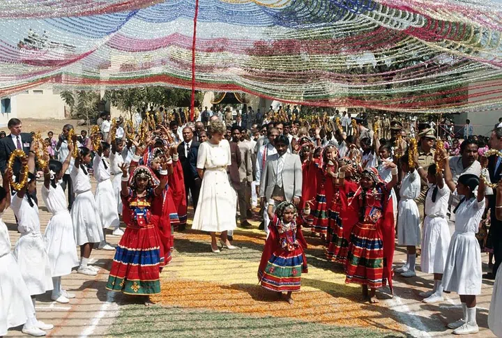 Receiving a warm welcome from traditional dancers as she arrives in Hyderabad, India.


