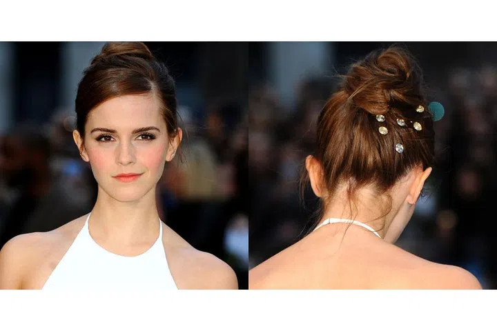 Rhinestone pins tucked into the back of a very '90s-inspired coiled bun.
