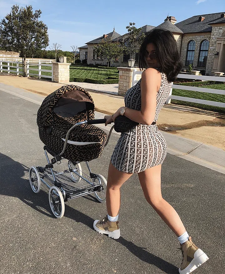 ...unless your name is Kylie Jenner, of course. Arguably the most popular logo of the moment, Fendi is winning the comeback trend right now. Jenner embraced the logo look with a Fendi dress, fanny pack, and matching baby stroller, but for most of us, a Fendi logo bag on its own will do the trend justice without going overboard.

Fendi bag, $3,650, net-a-porter.com.