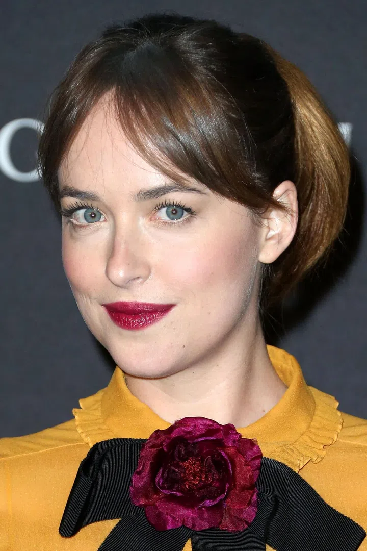 Keep your bi-monthly trim appointments throughout the growing-out process and ask your stylist to gradually taper your bangs so they're soft and sweeping when you wear them parted down the middle. Photo: Getty