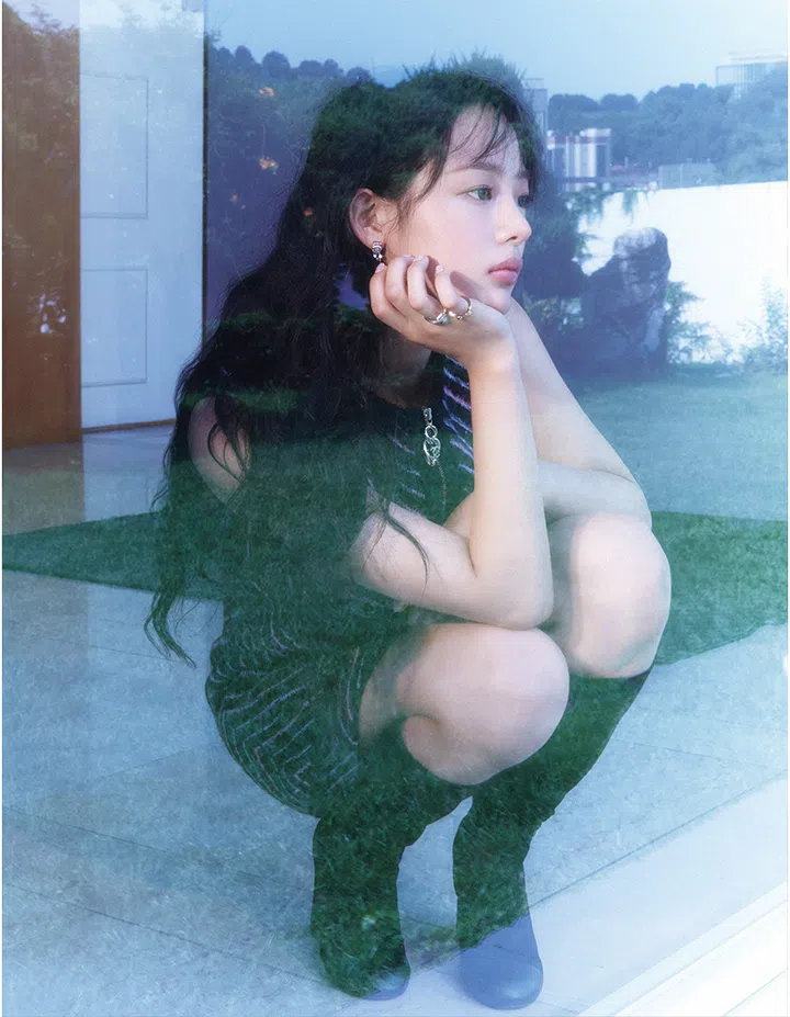 Minji NewJeans wearing Chanel No. 5 jewellery rings