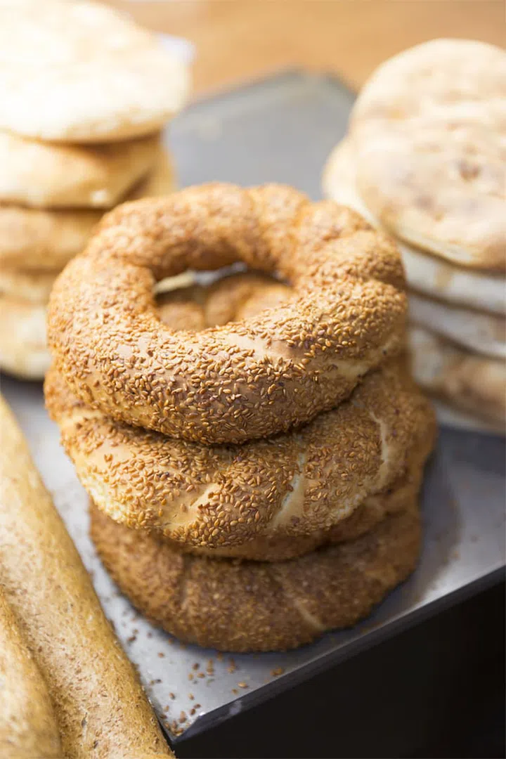 If you're all about that bagel in the morning, consider the fact that most bagels are the equivalent of four (or more!) slices of white bread. Talk about carb overload. But you don't have to give them up entirely; just choose the whole-grain kind and top with avocado or peanut butter, which contains both protein and healthy fat to keep you full and energized.