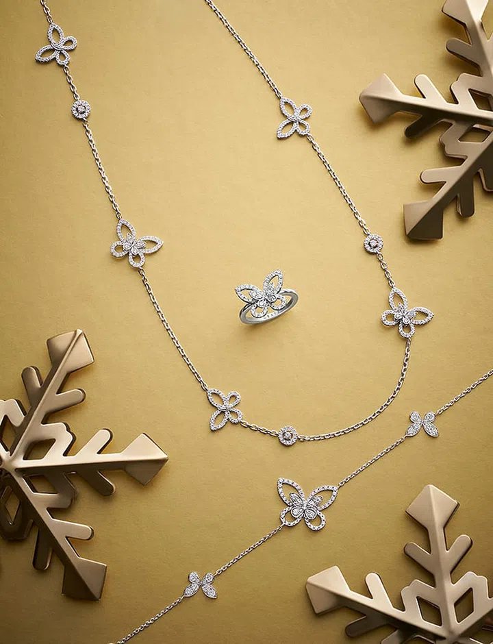 GRAFF BUTTERFLY SILHOUETTE COLLECTION:  White gold and pavé diamond sautoir necklace; ring; bracelet (from $6,800) 