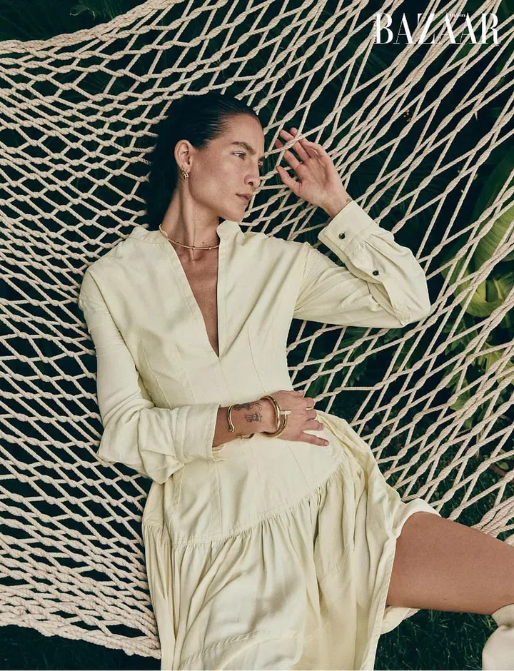 Dress; Bottega Veneta. Écrou de Cartier rose gold rings; rose gold and diamond earrings; rose gold necklace; gold and diamond Juste un Clou (large) bangle, Cartier. Nose ring (worn throughout), model’s own)