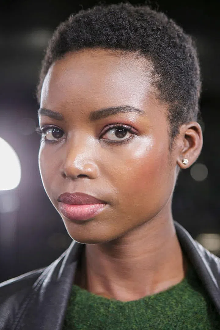 Backstage at Emporio Armani, models' skin was prepped with the Armani Prima Moisturizing Glow-On Balm to give it an all-over subtle glow. Makeup artists then topped the cheekbones with a shimmery blush to add a hint of warmth.