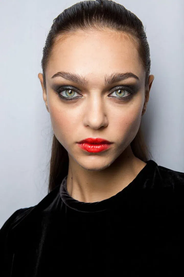 Carolina Herrera upped the ante by pairing her sooty black eyes with an equally bold lip. It was a one-two punch of serious makeup, and one of the first shows this season to send models down the runway wearing eye and lip color. 
