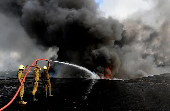 Aditya captures a massive fire that broke out in a chemical "godown" (warehouse) near the Howrah Bridge in Kolkata, India.   