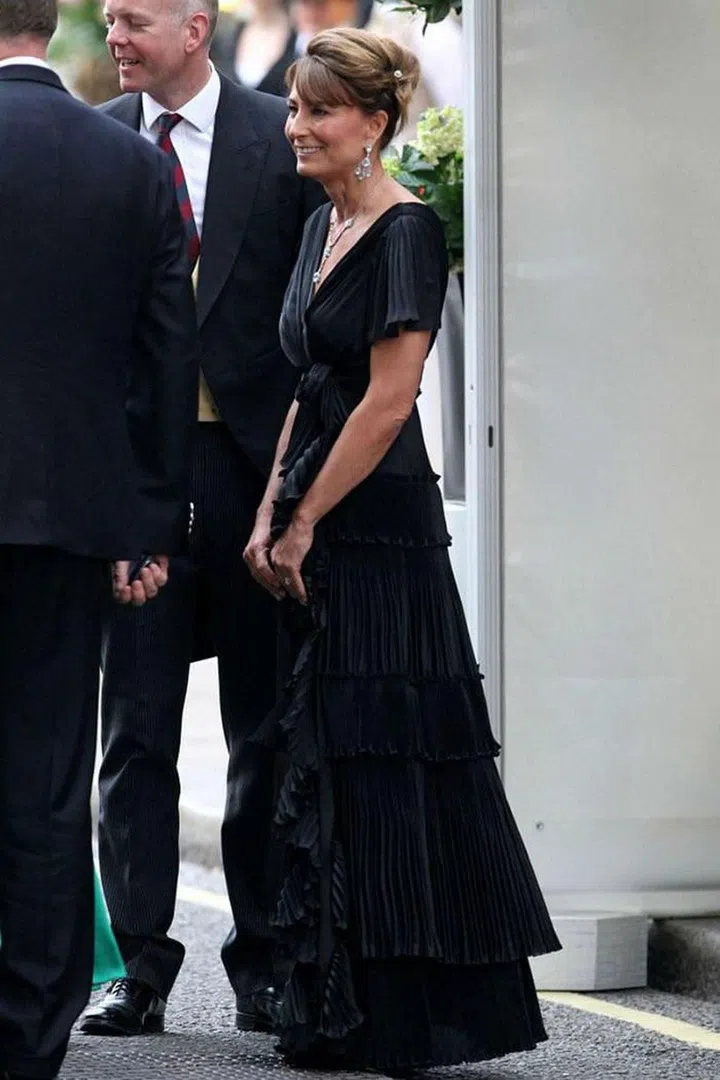 Carole Middleton changes from her gray suit to a long black pleated gown for the evening's celebrations.
Photo: Getty
