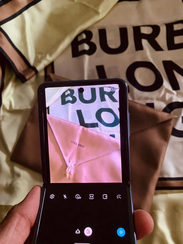 Guests at the Burberry show went home with a silk twill scarf and a matching pouch that was stamped with the show date.