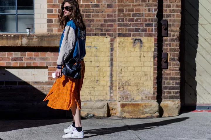 Style your white kicks with a pair of black socks to make the look really pop. Photo: Getty