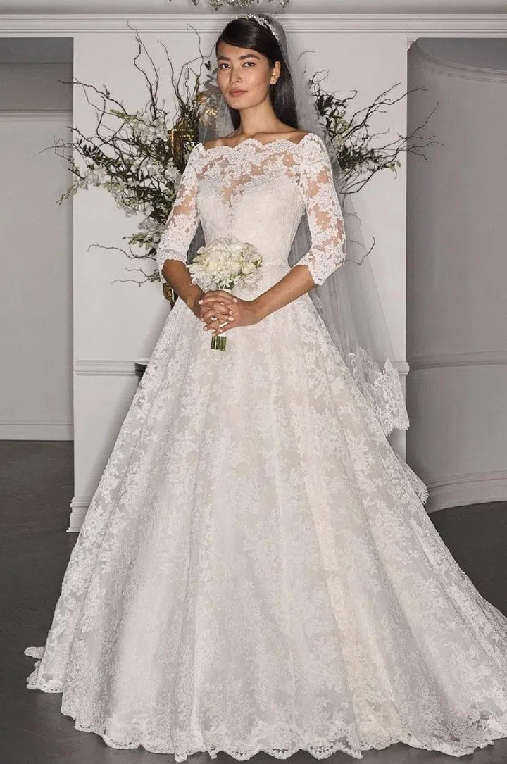 An all-lace gown with an off-shoulder neckline and three-quarter sleeve rather than a high neckline and a cap-sleeve would also achieve the overall classic yet modern feel that PIppa's gown did so effortlessly.

Legends by Romona Keveza gown, legendsromonakeveza.com
