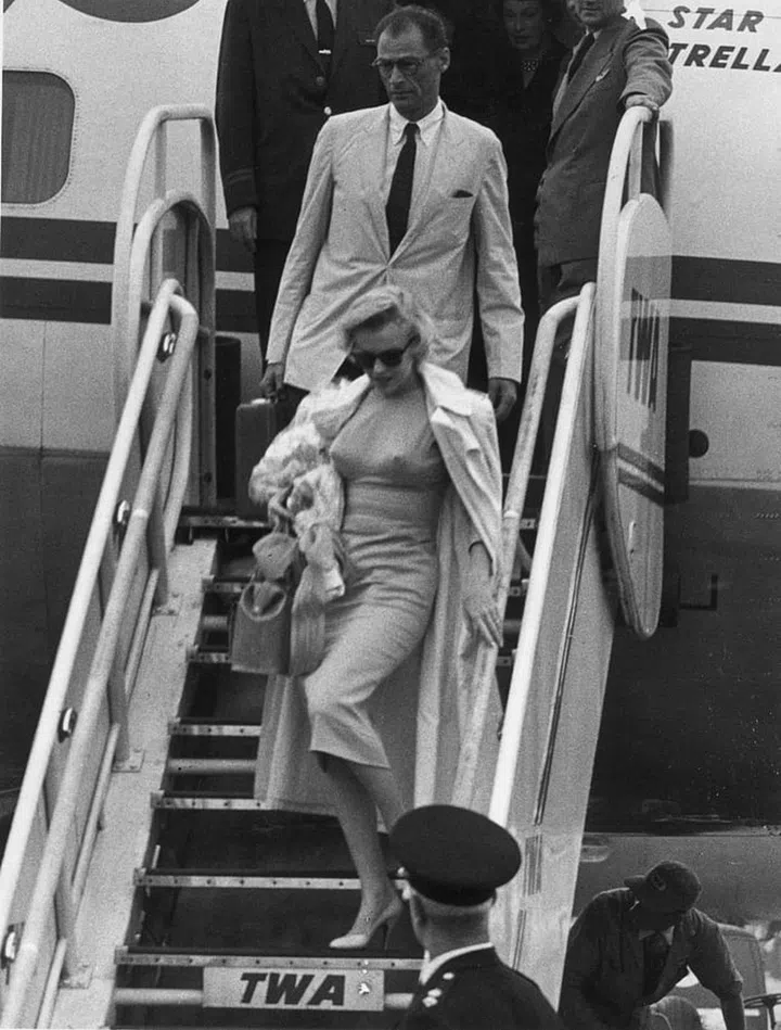 The actress and her playwright husband descended an airplane ramp after arriving at London Airport, England. 

Photo: Getty