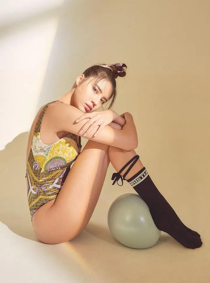 Swimsuit, from Fendi. Scarf (in hair), from Hermès. Socks, from Dior. (Photo: Veronica Tay)