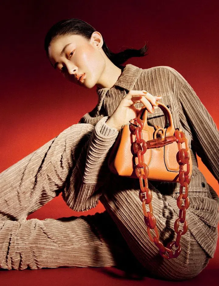 Roseau Chaine Mini Top Handle bag, $1,020; jacket, $1,730; matching trousers, $620.