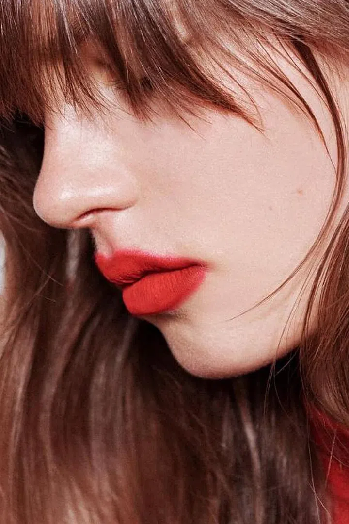 On the other end of the spectrum, we've got the angora sweater of lipstick here, in which you run your fingertip to soften the edges for a just-been-carefully kissed effect. This is the anti-Instagram makeup. 
