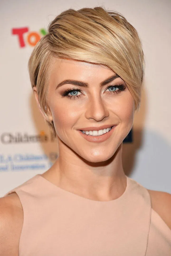 Some magic has taken place here to keep Hough's hair without any stray hairs in sight, and we're going to have to chalk it up to some straight iron enchantment. Photo: Getty