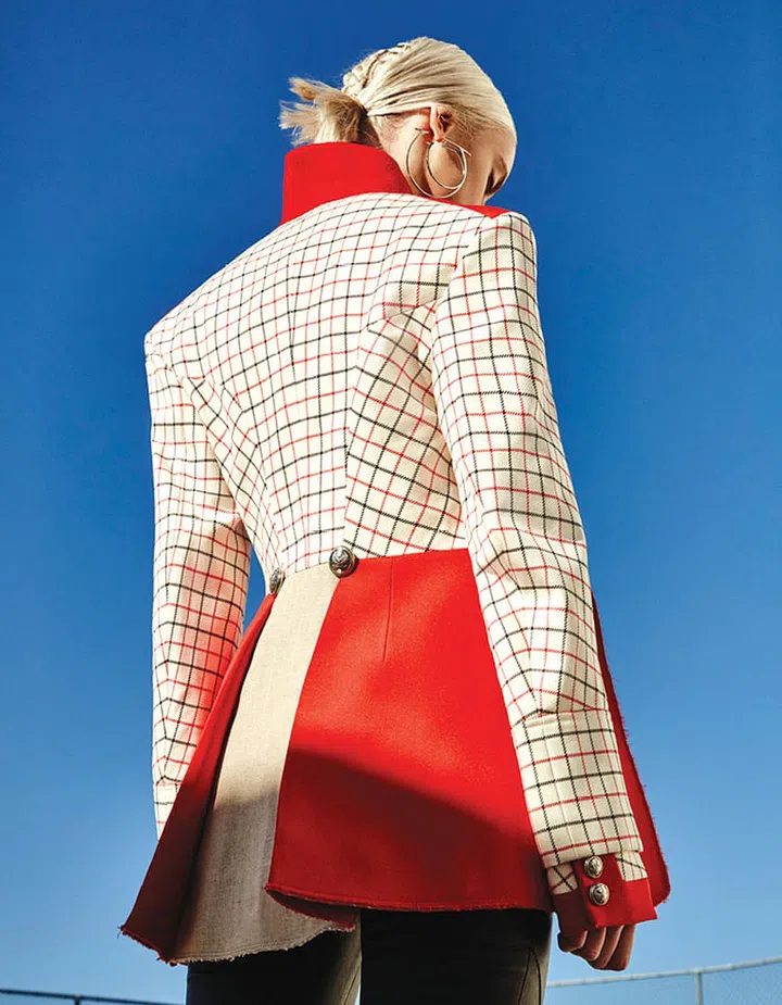 Wool coat; leather pants, Alexander McQueen. Metal earrings, Salvatore Ferragamo