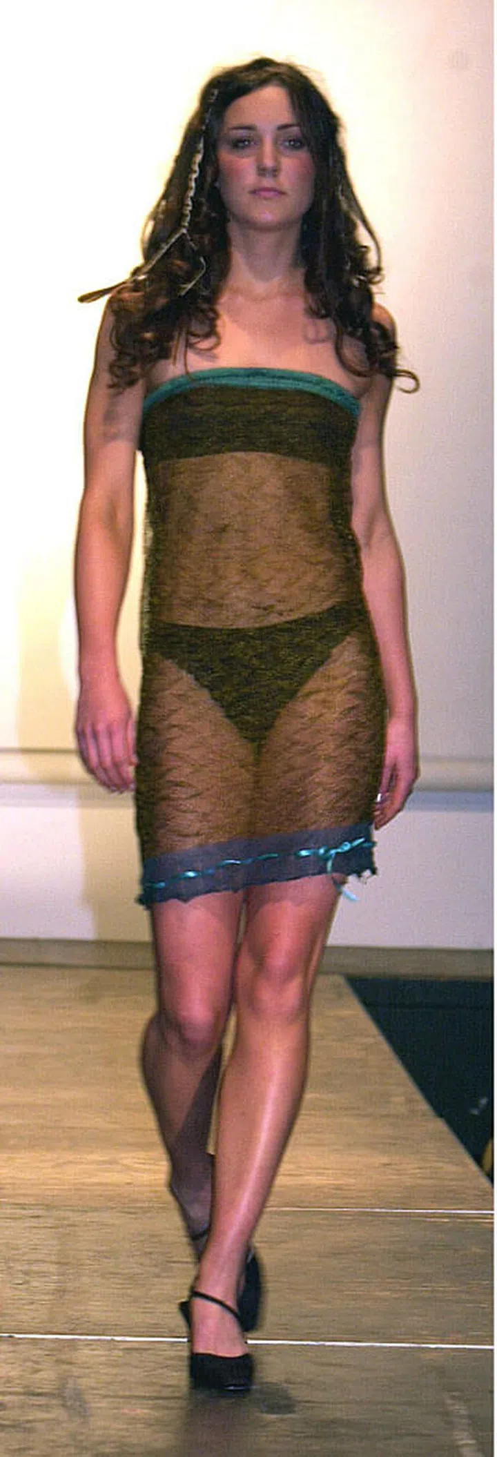 It's unlikely that the Duchess of Cambridge would wear such a daring dress today (she prefers a full-skirted midi look now), but in 2002 she bravely took part in the St Andrews University fashion show wearing a sheer knit tube dress. It was, apparently, the outfit that wooed Prince William.
