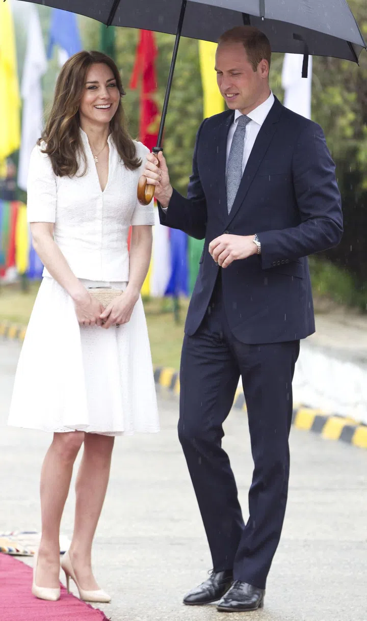 Kate Middleton wore crisp white Alexander McQueen separates at Paro Airport before boarding a flight to Agra for their visit to the Taj Mahal.